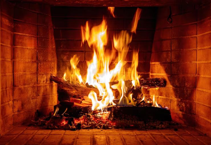 Fire burning in a clean, well-maintained fireplace